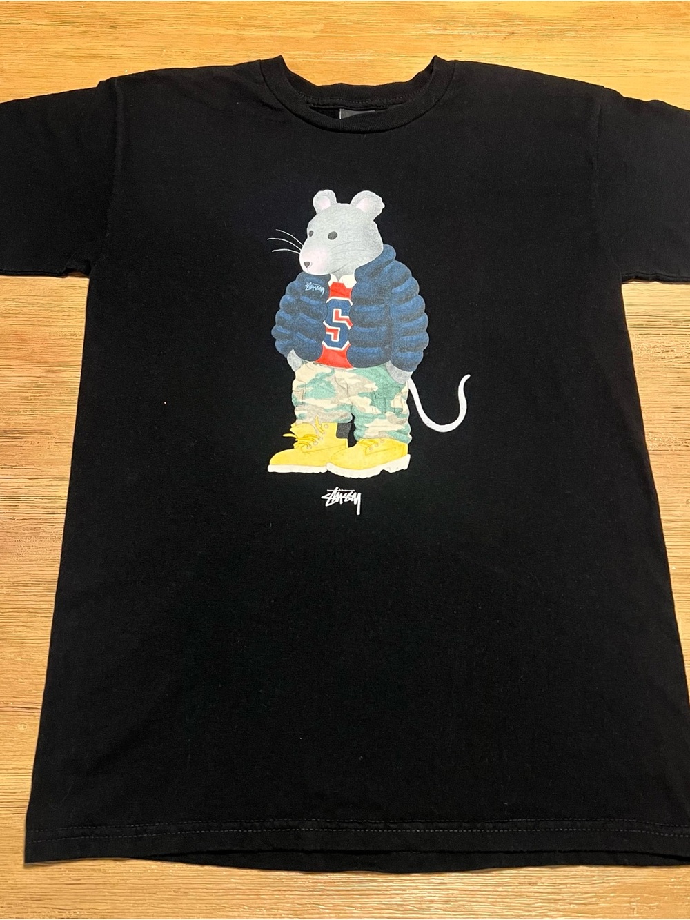 Stussy Black Tee with Rat Graphic in Blue Puffer and Yellow Boots